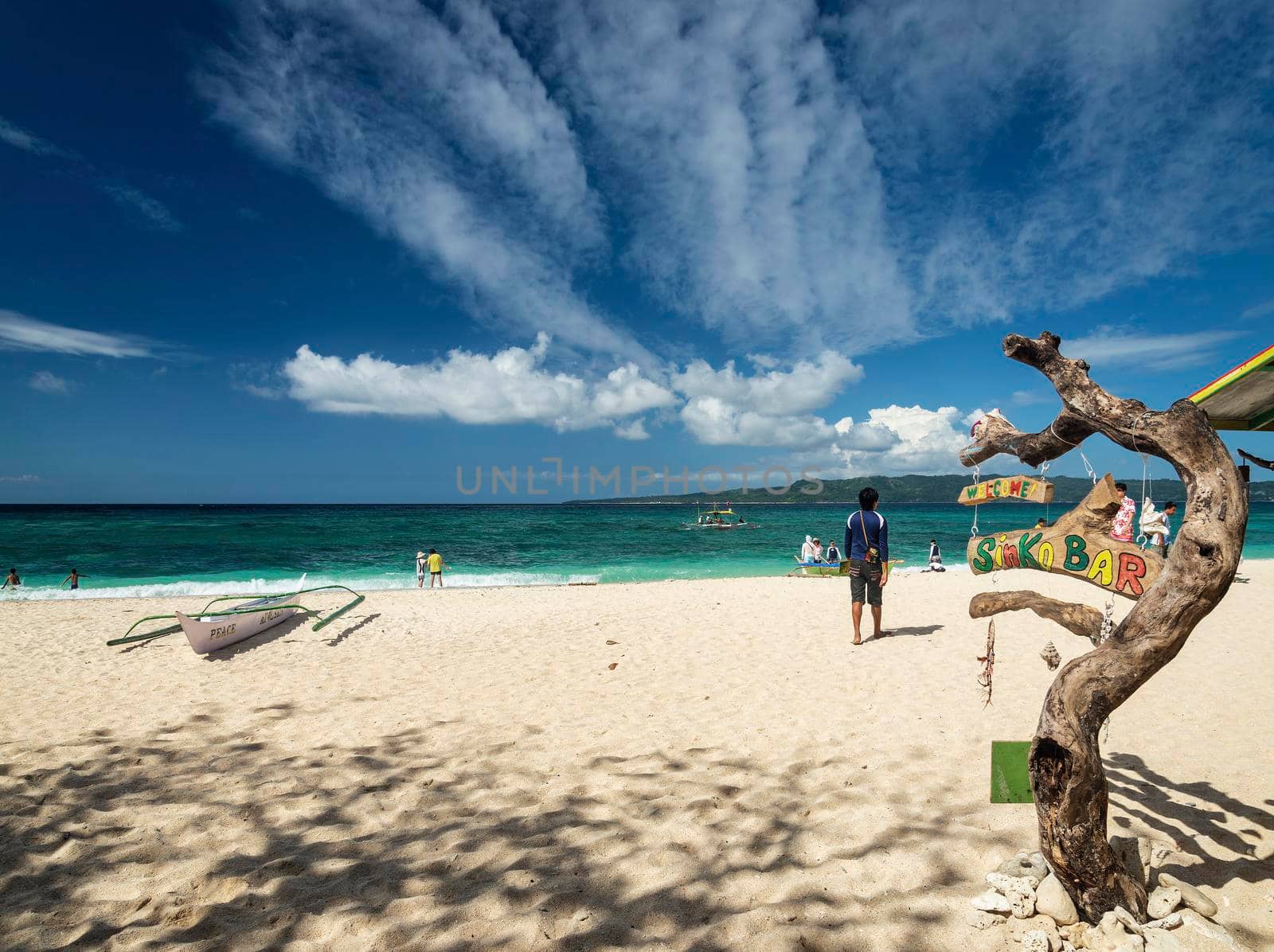 famous puka beach on tropical paradise boracay island in philippines by jackmalipan
