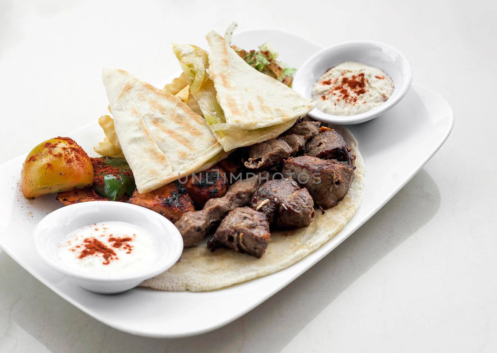 lebanese meshwi mixed bbq grilled meat set with chicken, lamb and beef in beirut restaurant