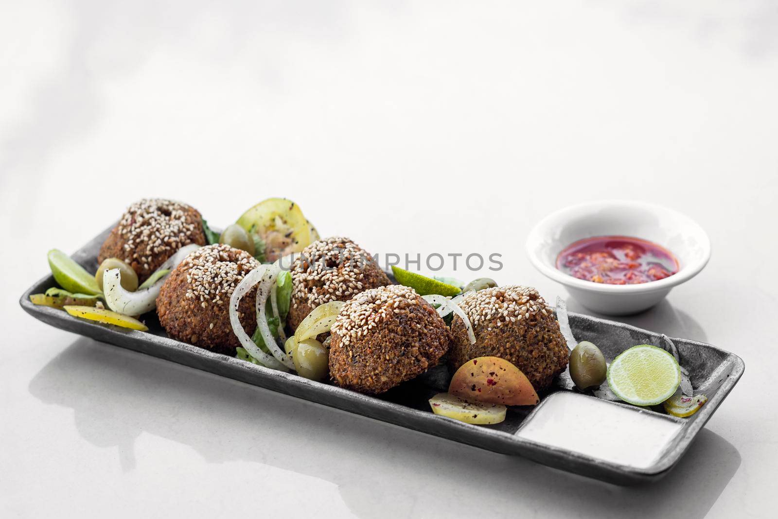 lebanese organic falafel plate with pickles salad and sauces