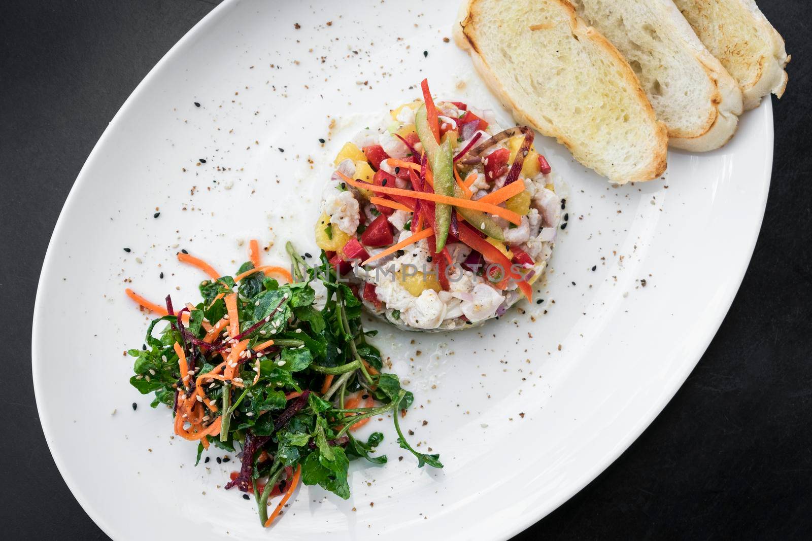 raw marinated sea bass fish ceviche salad modern gourmet fusion cuisine starter set in melbourne australia restaurant