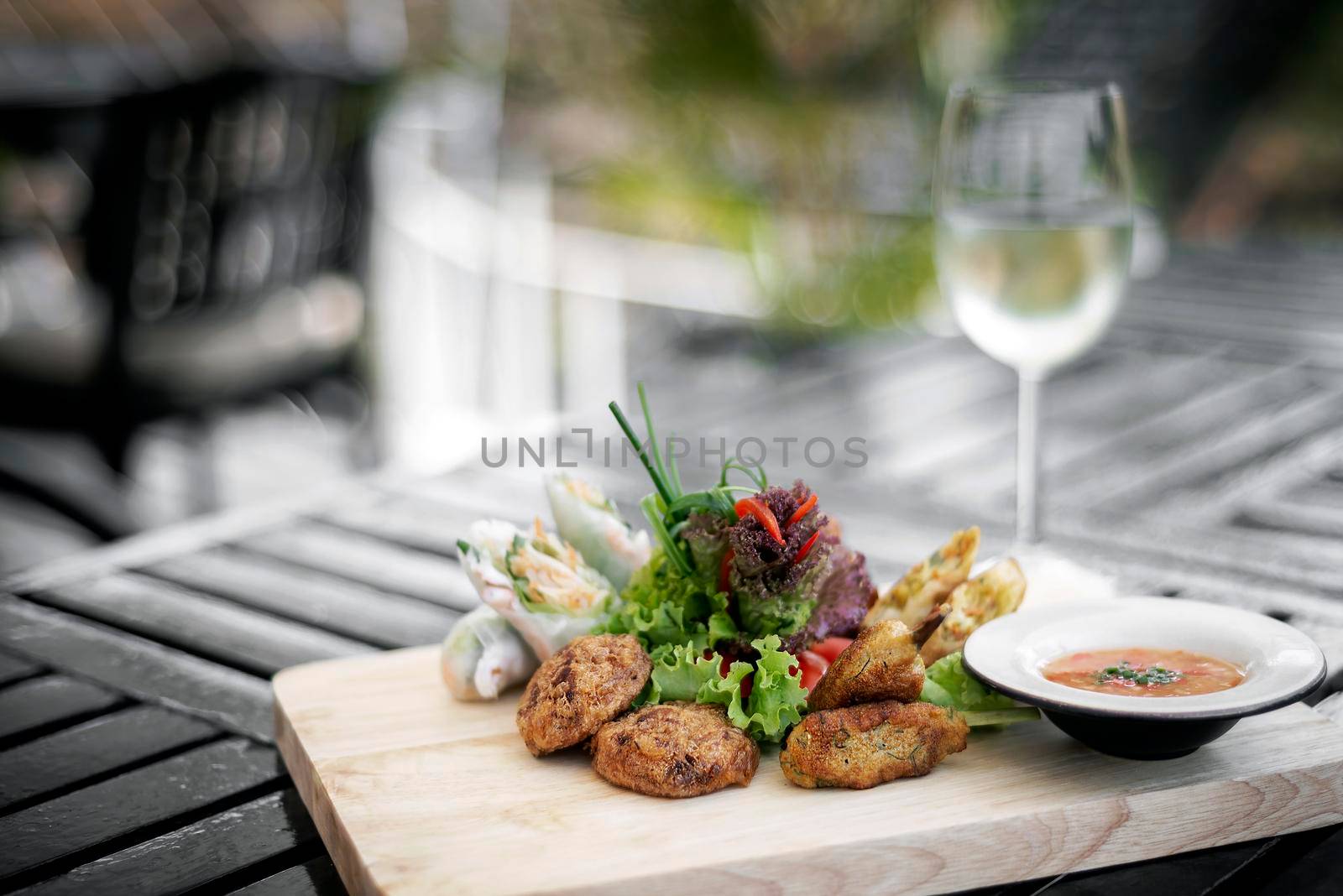 mixed asian seafood snacks tapas platter on bangkok restaurant table