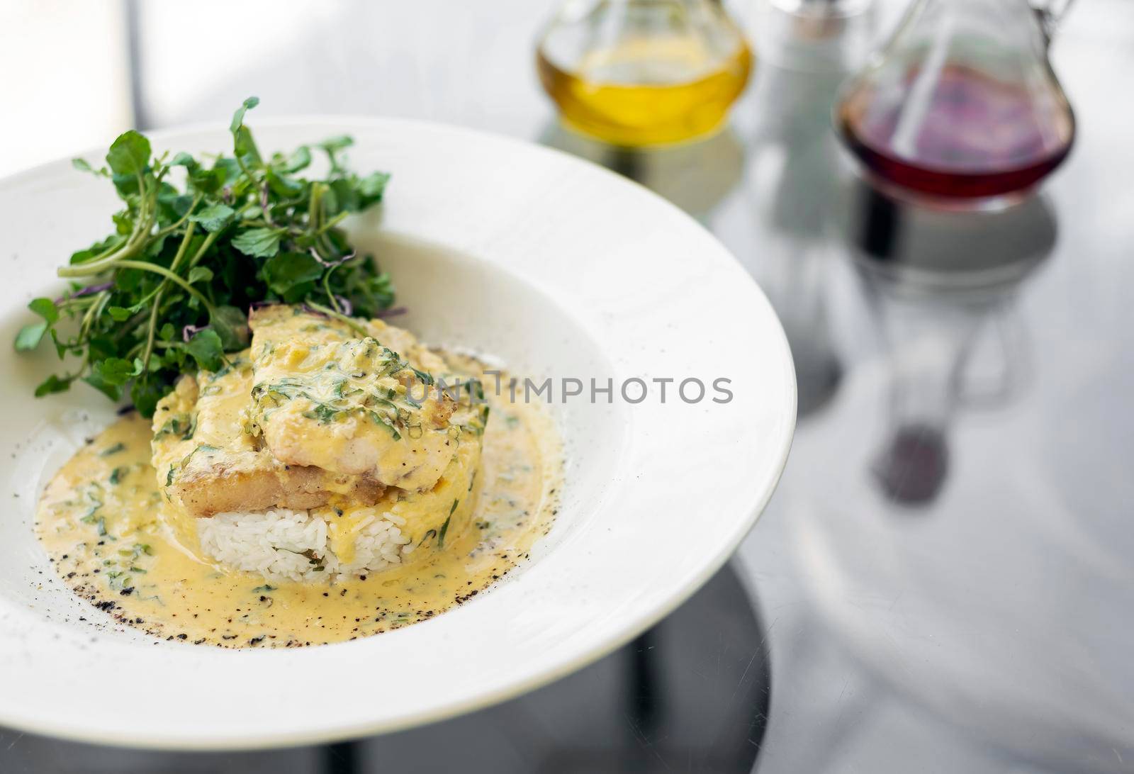 sea bream fish fillet in creamy mustard dill and lemon sauce restaurant meal on plate
