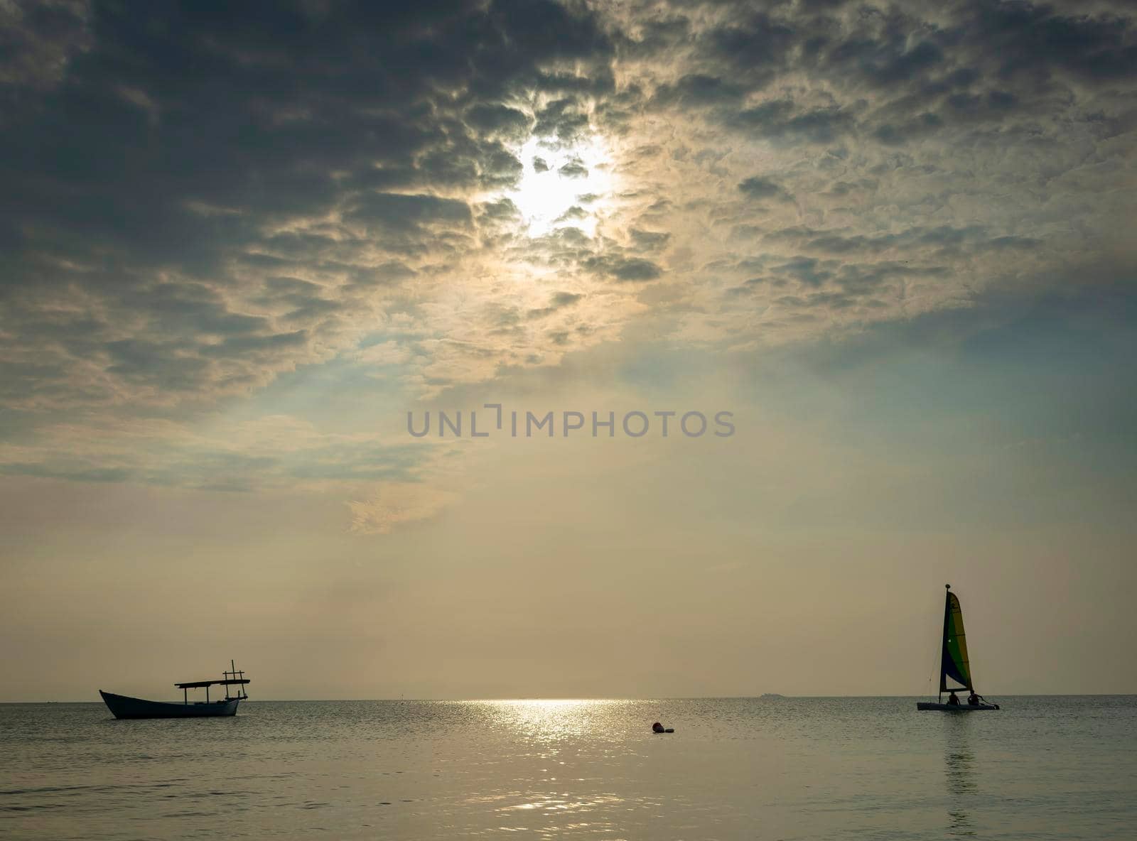 sailing boat at sea during sunset in phuket coast of thailand