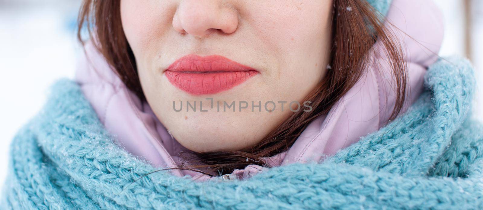 Girl on the street smiles and braces are visible on her teeth by AnatoliiFoto