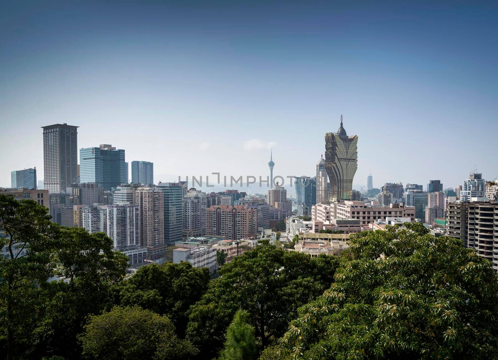 urban skyline view with tower blocks in central macau city by jackmalipan