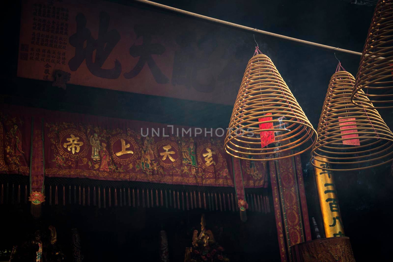 traditional  burning incense coils inside chinese a-ma temple in macau by jackmalipan