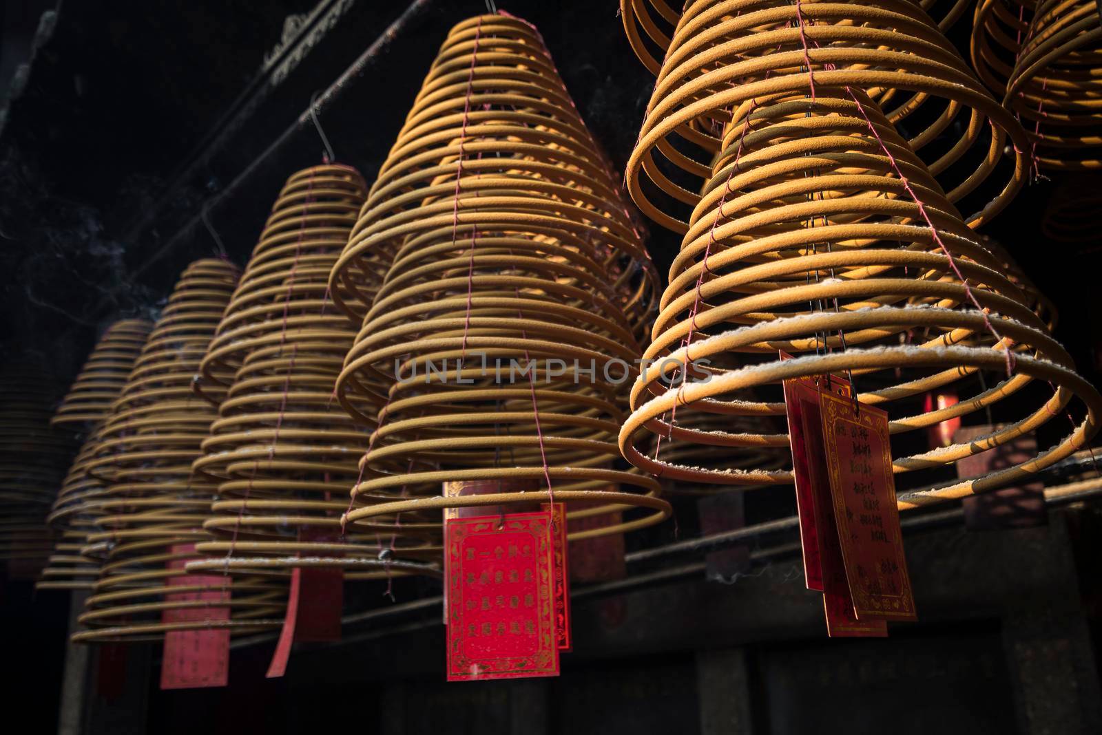 traditional  burning incense coils inside chinese a-ma temple in macau by jackmalipan