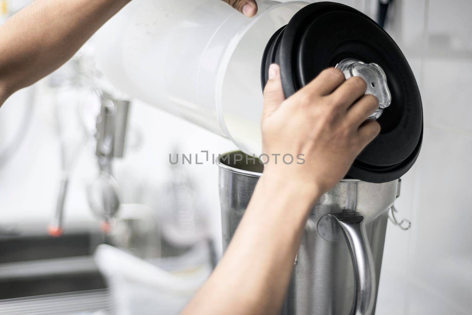 making gelato ice cream with modern equipment in kitchen interior  by jackmalipan