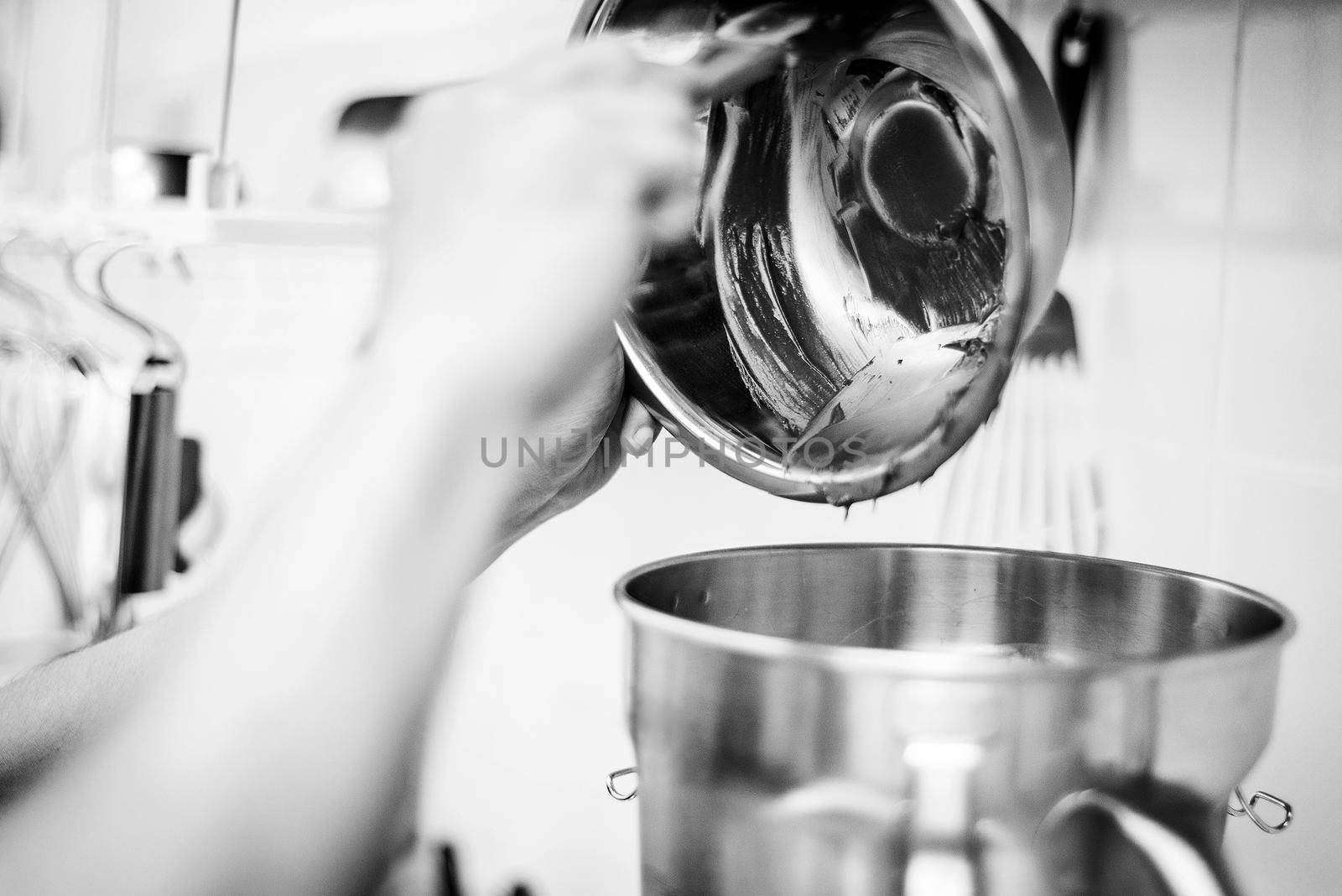 making gelato ice cream with modern professional equipment preparation detail in kitchen interior black and white photo