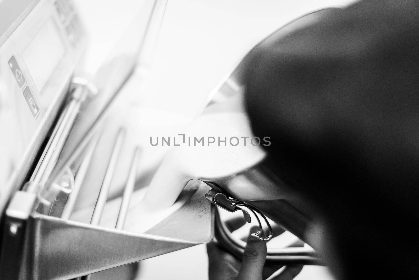 making gelato ice cream with modern professional equipment preparation detail in kitchen interior black and white photo