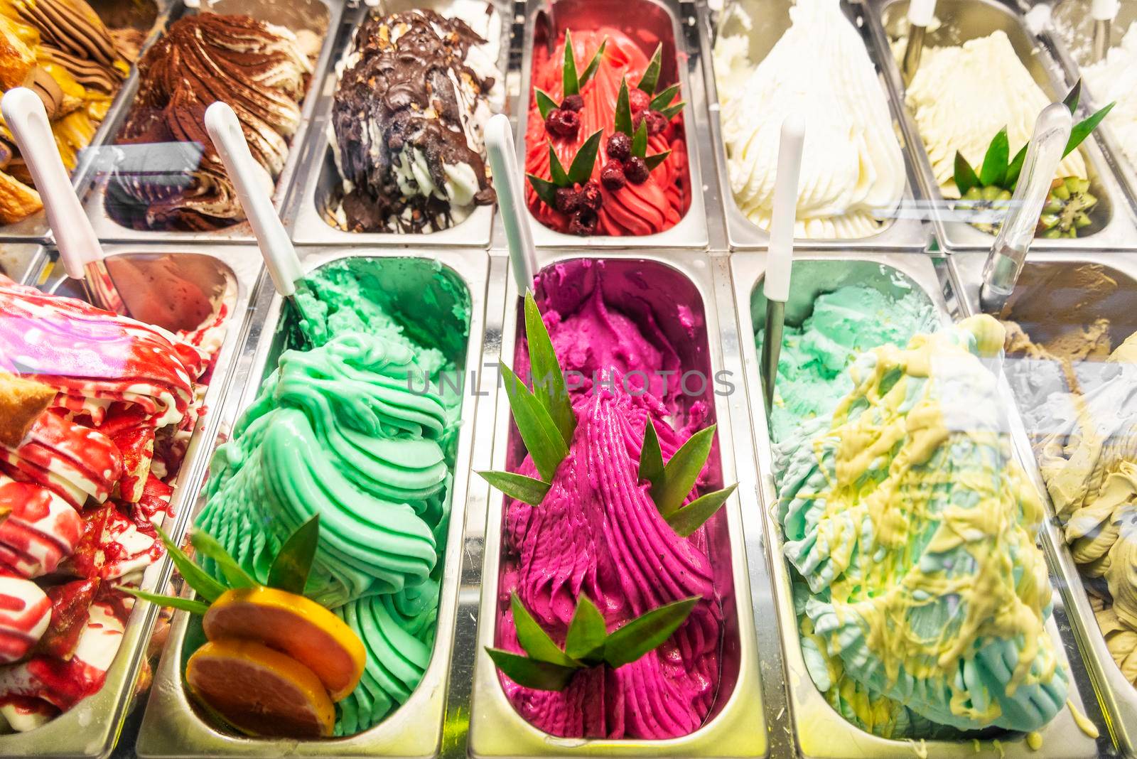 various italian gelato ice cream flavours in modern shop display by jackmalipan