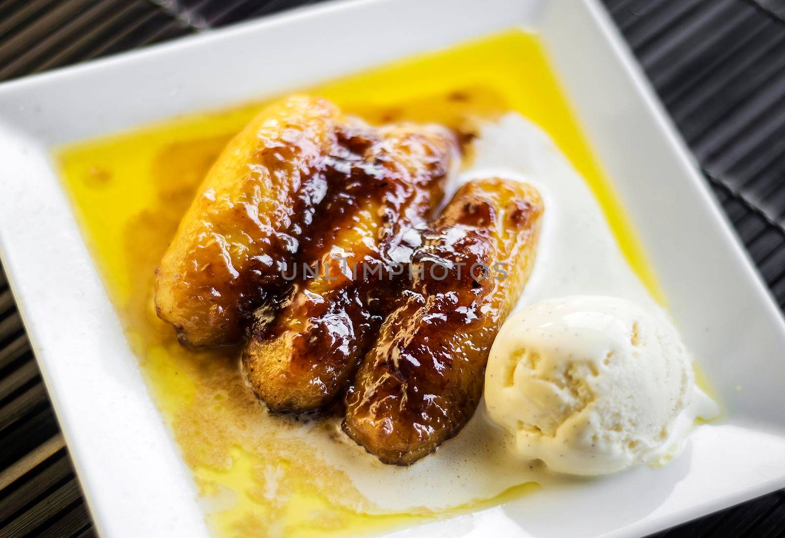 asian fried banana and sugar cane caramel dessert with coconut ice cream