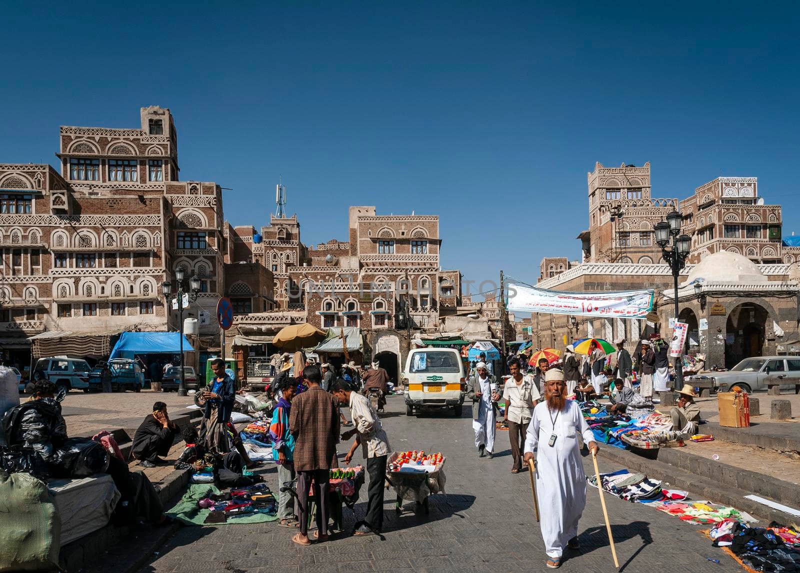 street scene and local heritage architecture buildings in old town of sanaa yemen