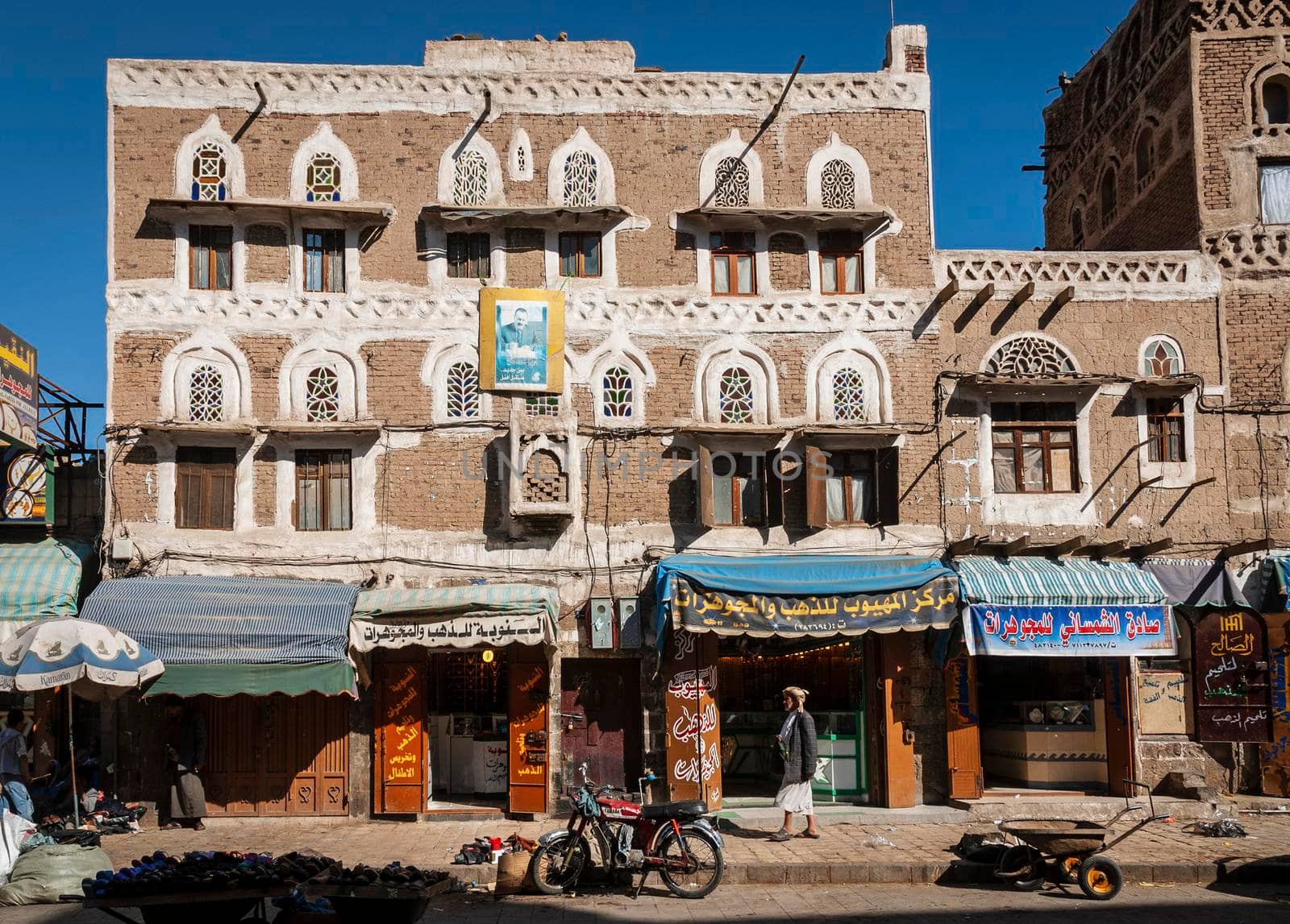 street scene and buildings in old town of sanaa yemen by jackmalipan