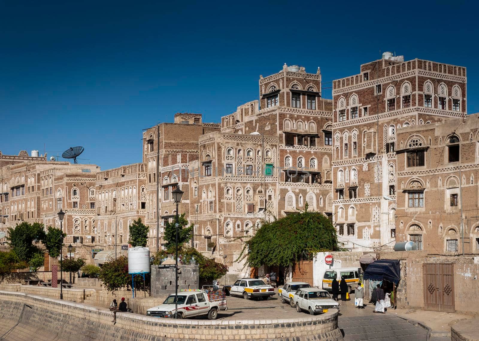 street scene and local heritage architecture buildings in old town of sanaa yemen