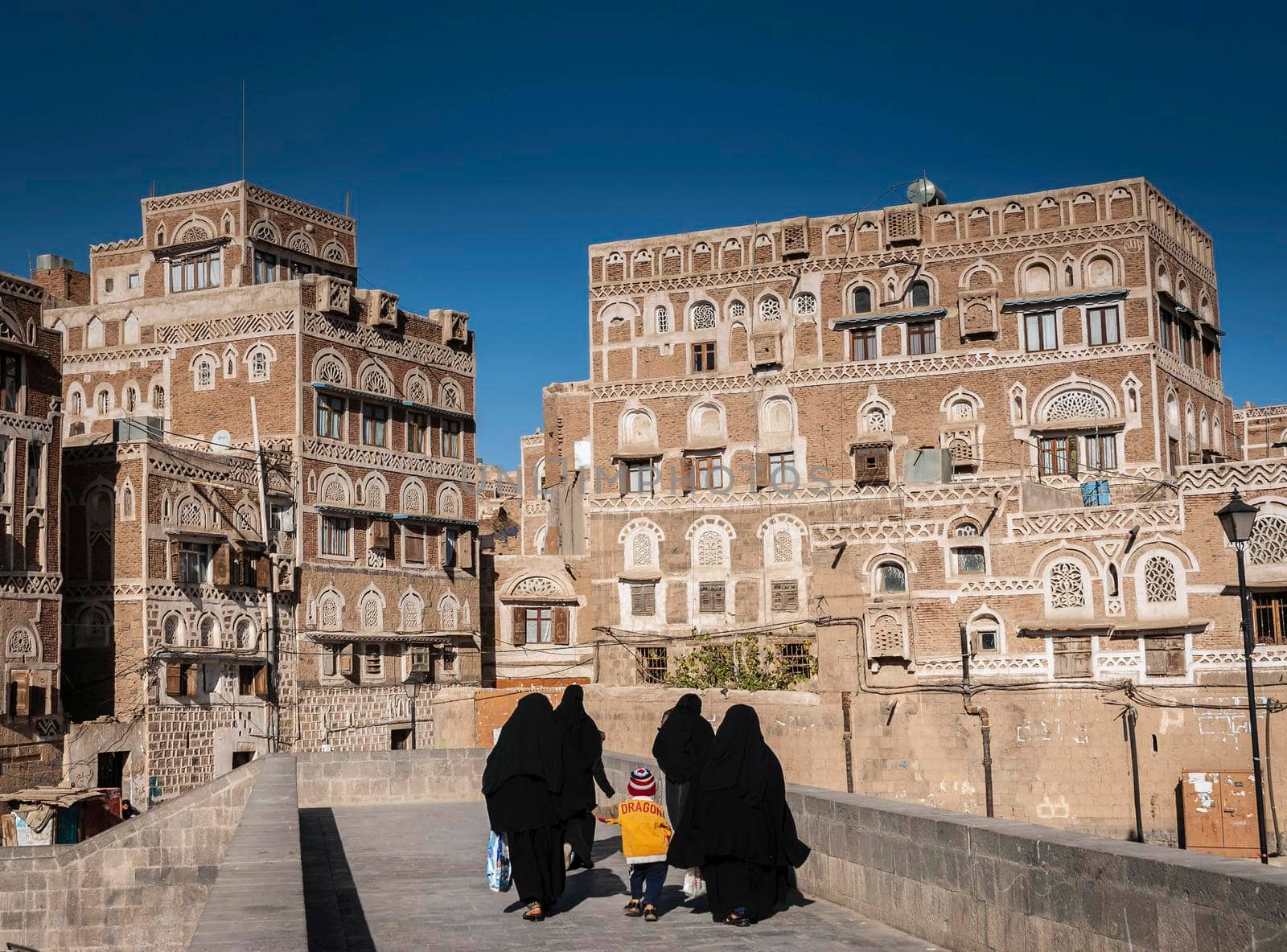 street scene and buildings in old town of sanaa yemen by jackmalipan