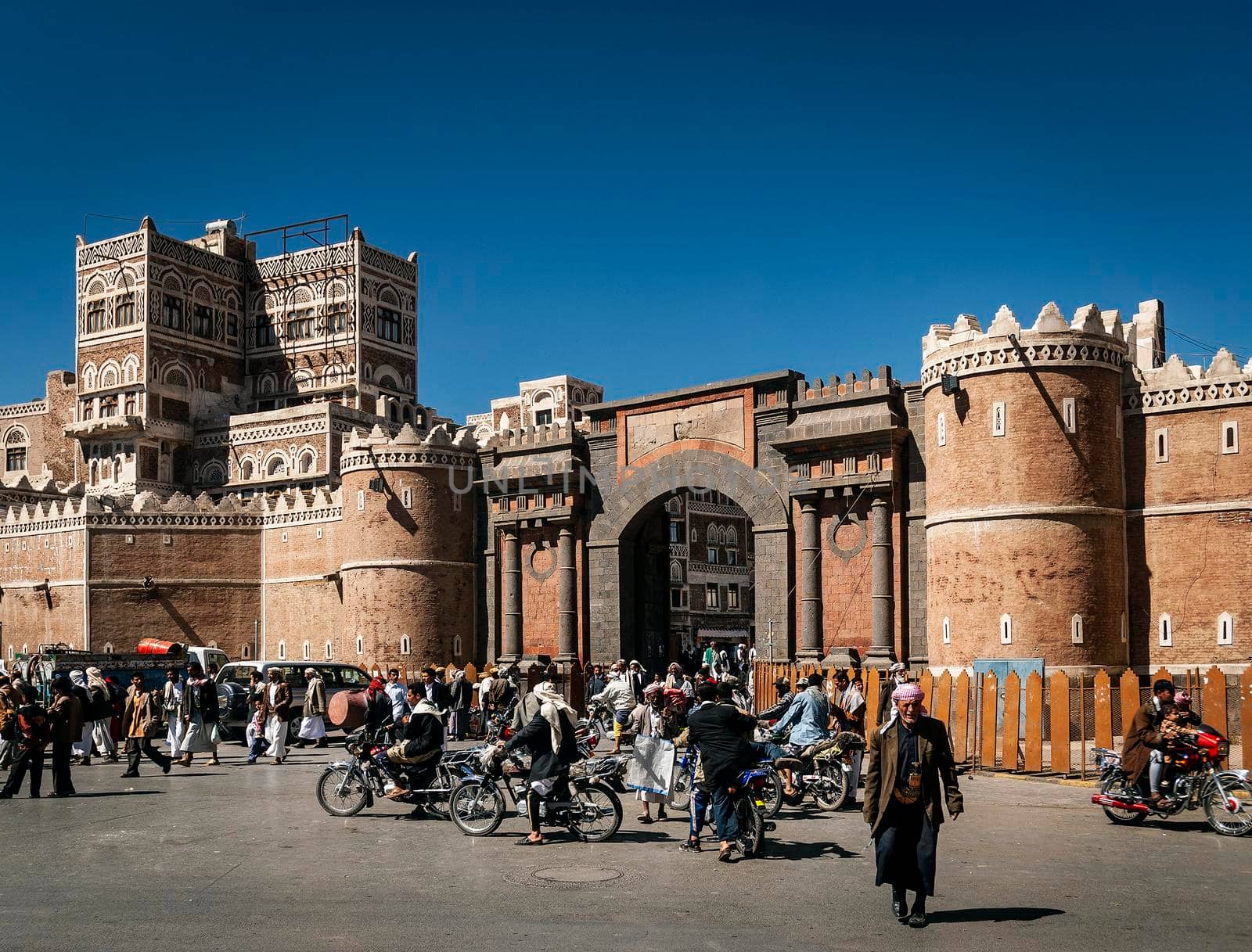 street scene and local heritage architecture buildings in old town of sanaa yemen at Bab Al Yemen gate