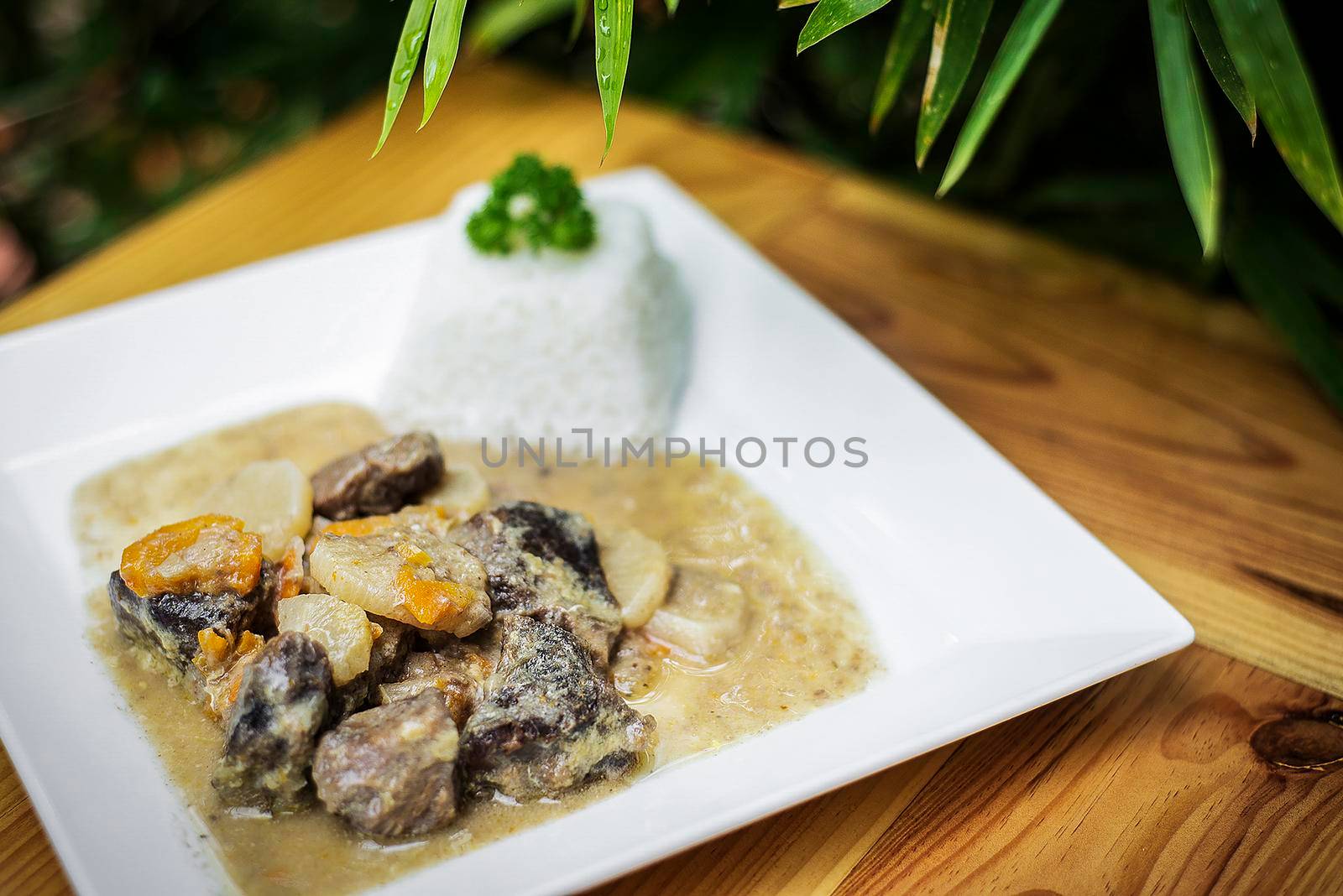 organic beef and sauerkraut cream vegetable stew on wooden table