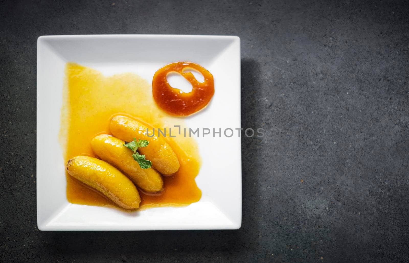 flambeed fried banana in orange reduction and tangerine caramel by jackmalipan