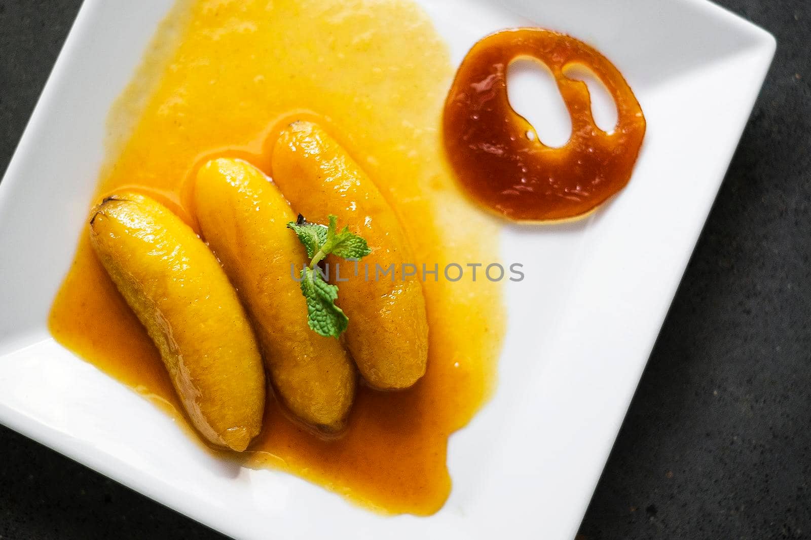 flambeed fried banana in orange reduction and tangerine caramel by jackmalipan