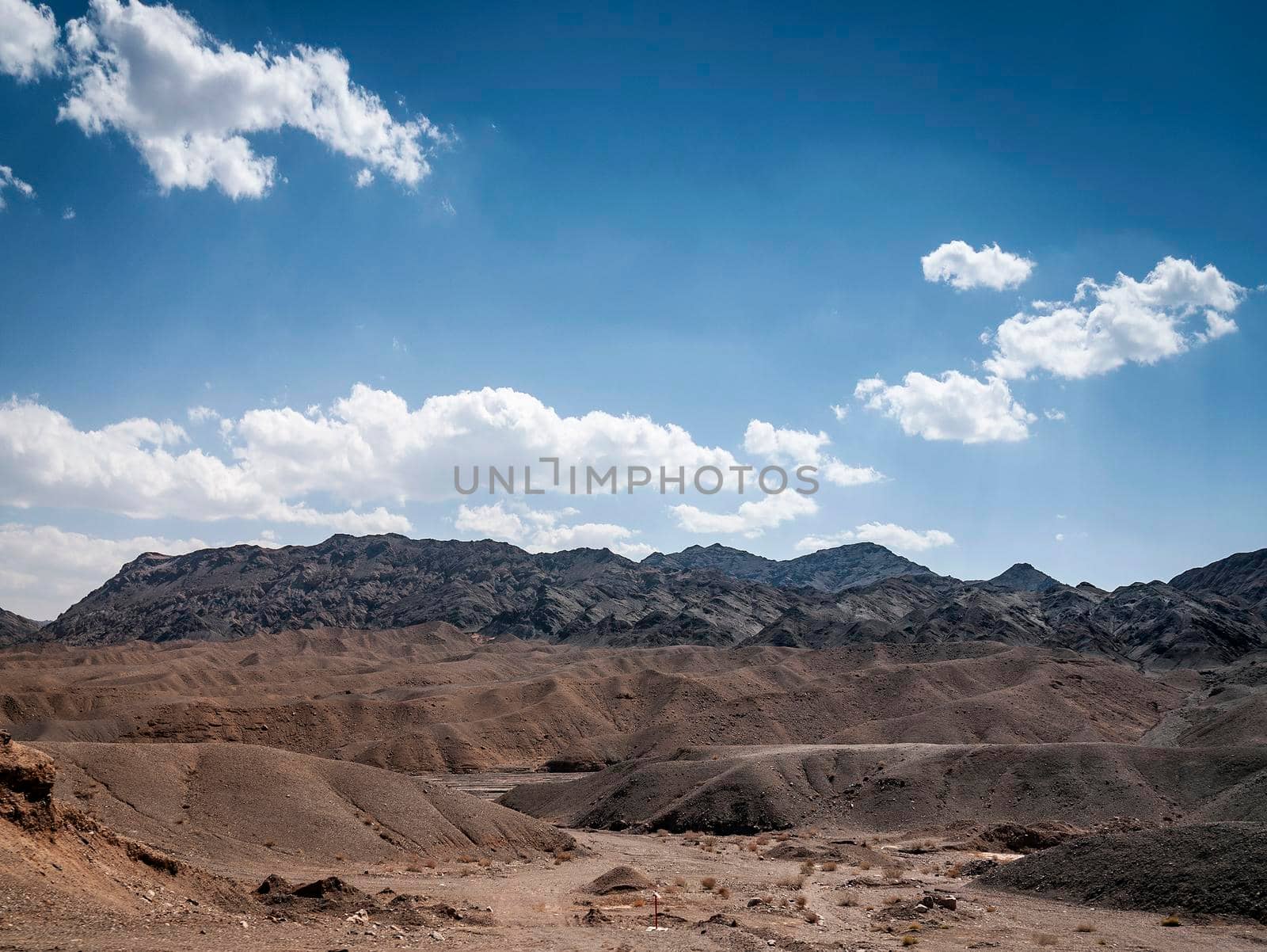 dry desert landscape view near yazd in southern iran on sunny day