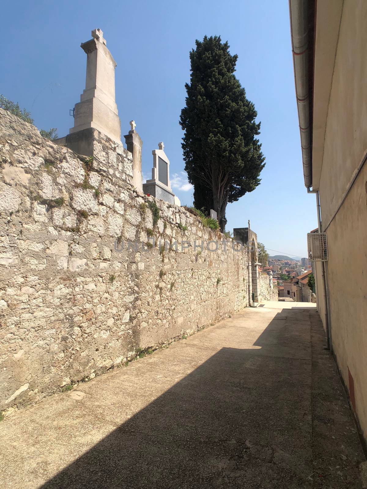 Alley in the old town of Sibenik by traveltelly