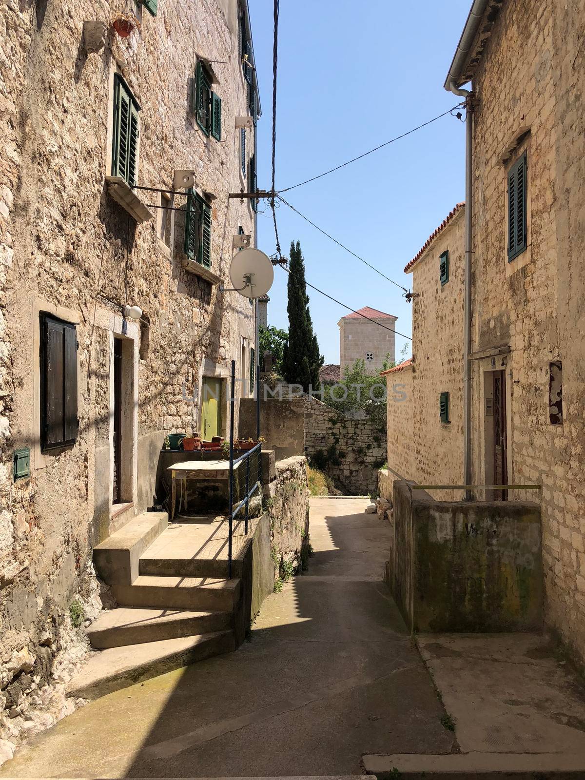 Alley in the old town of Sibenik by traveltelly