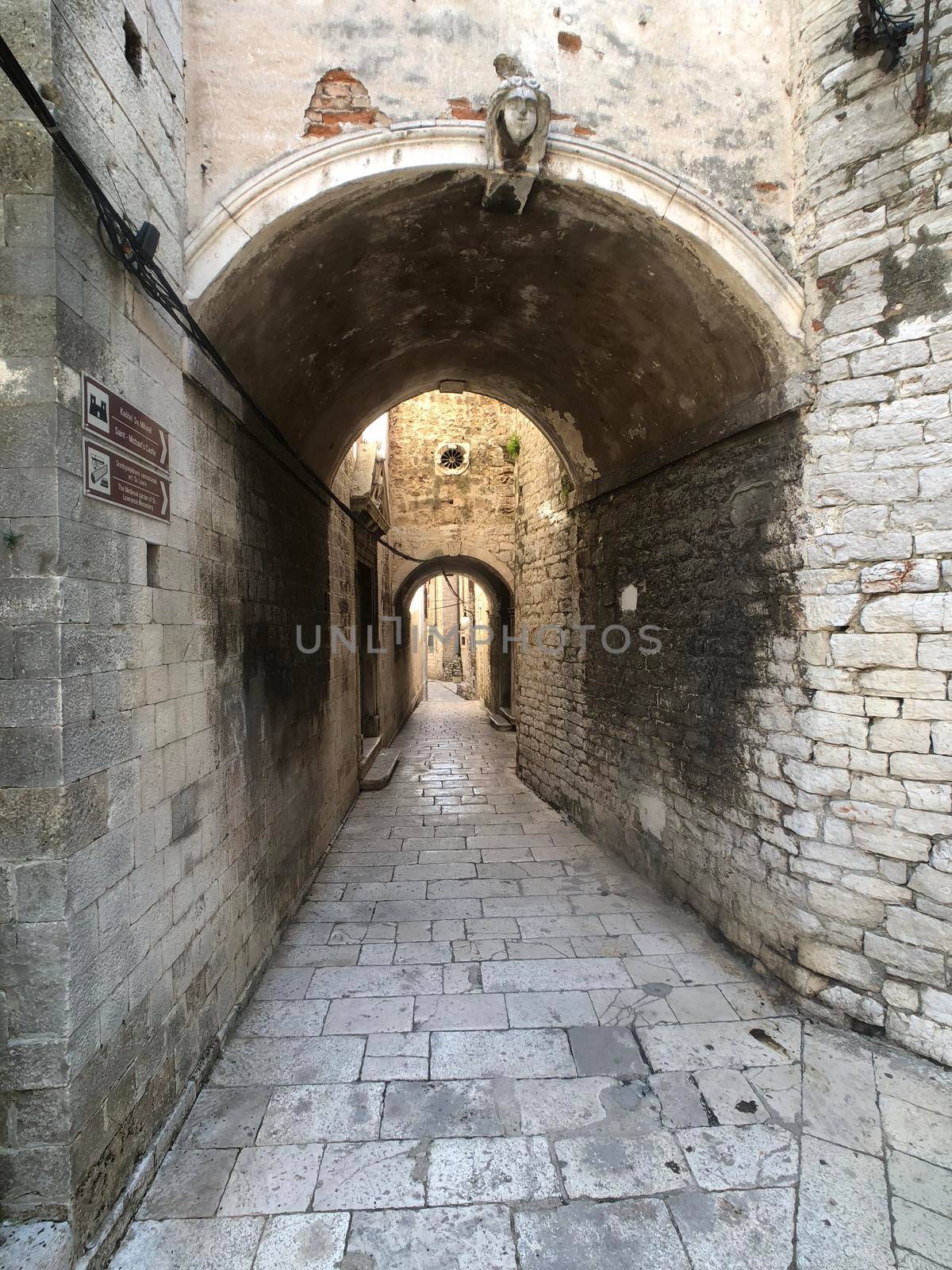 Gate in the old town of Sibenik by traveltelly