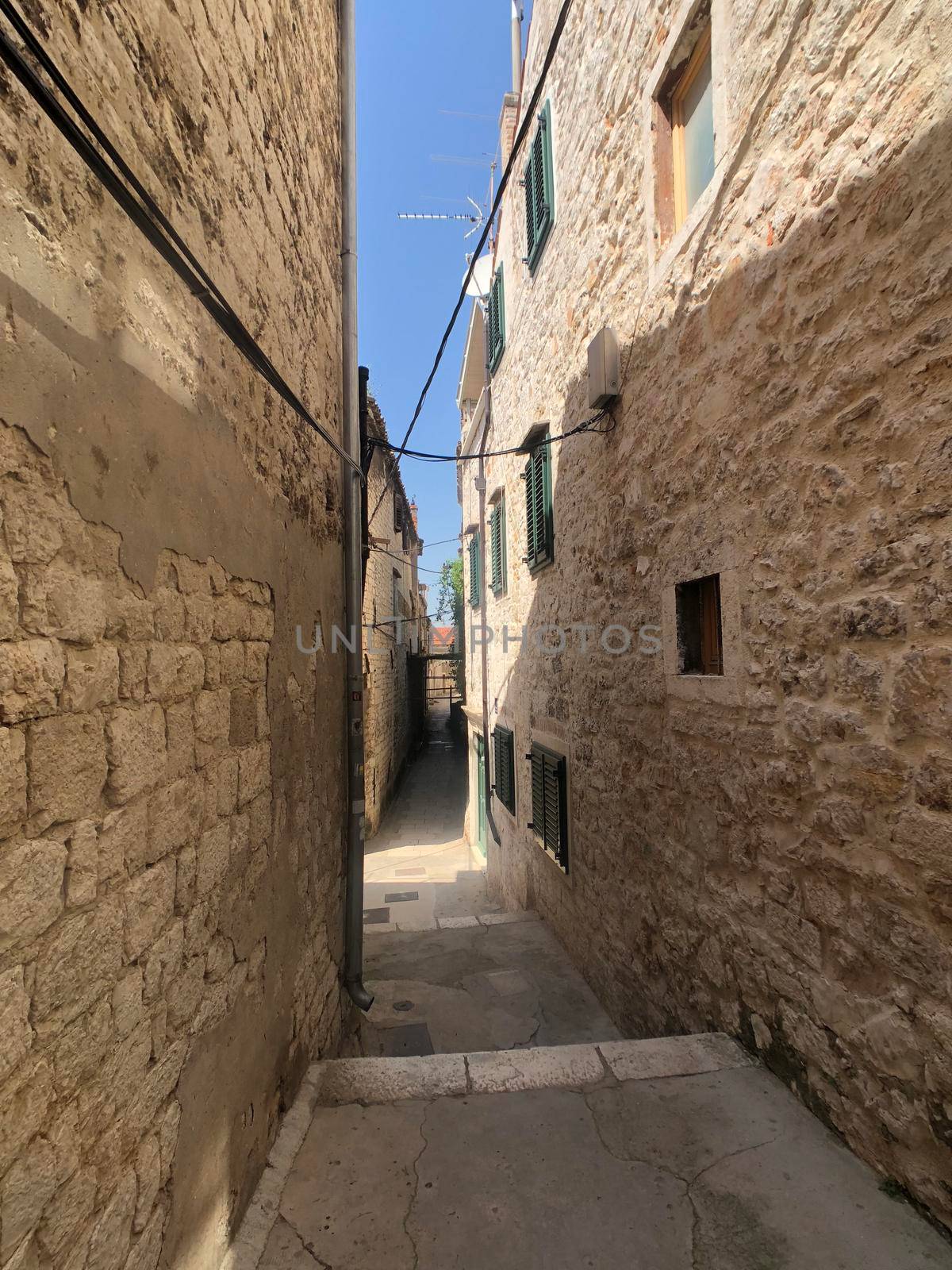 Alley in the old town of Sibenik by traveltelly