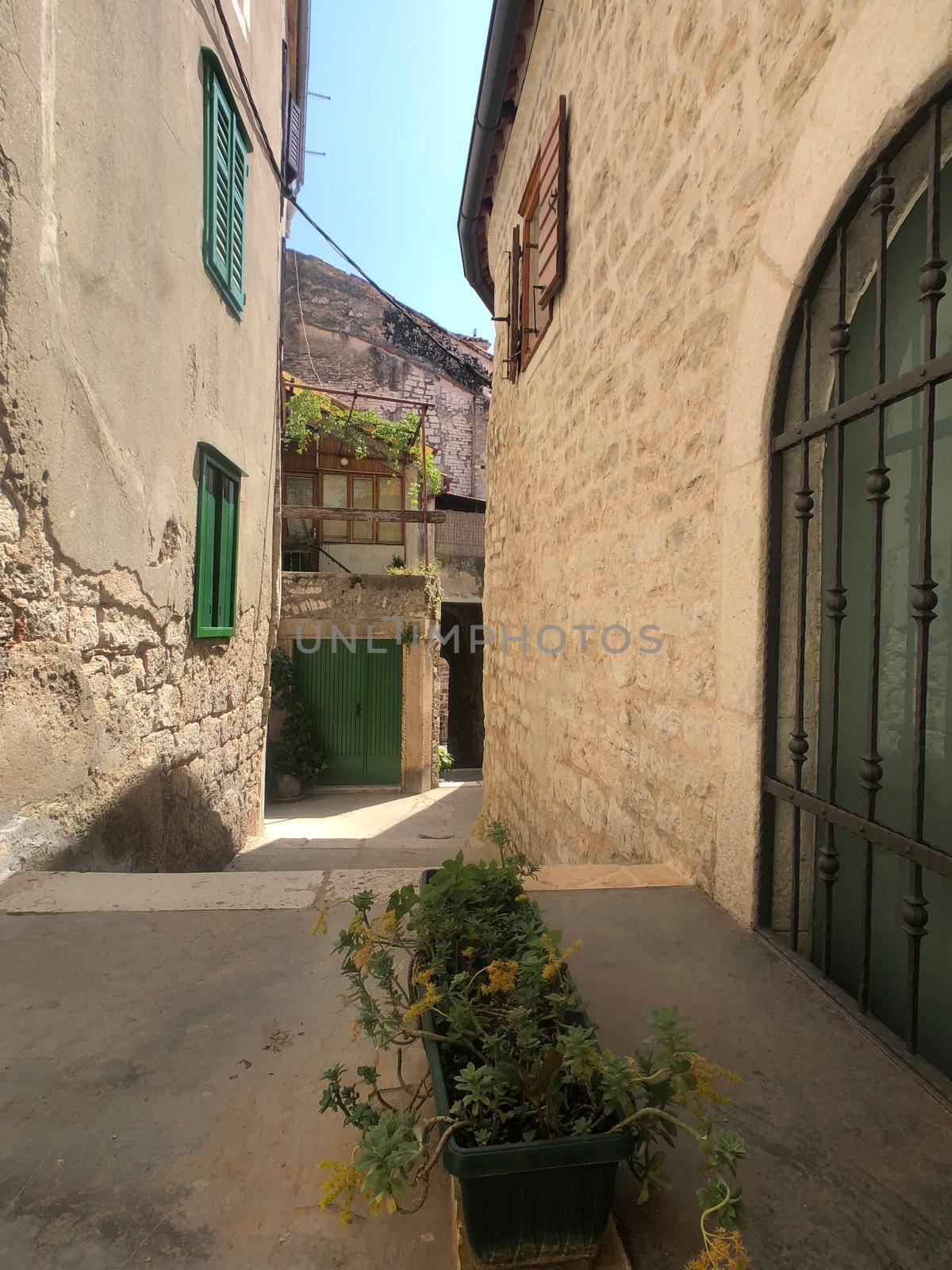 Alley in the old town of Sibenik by traveltelly