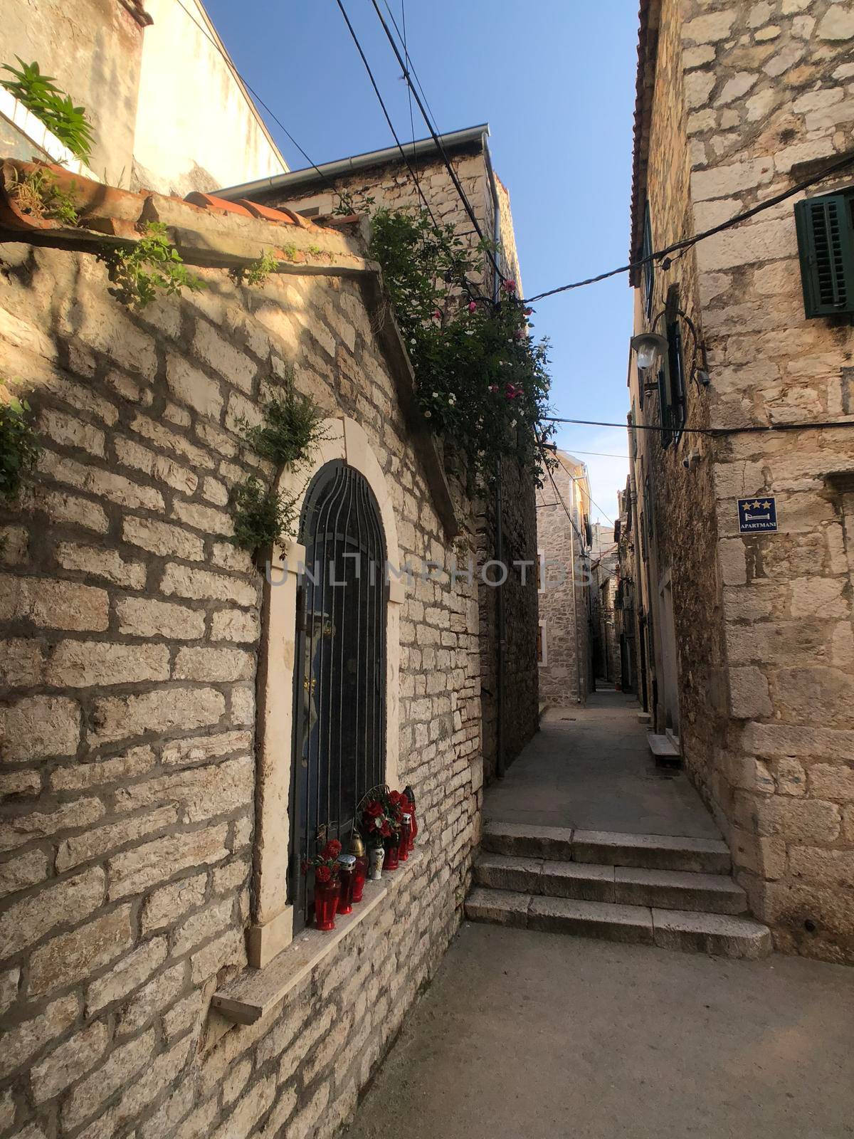 Alley in the old town of Sibenik by traveltelly