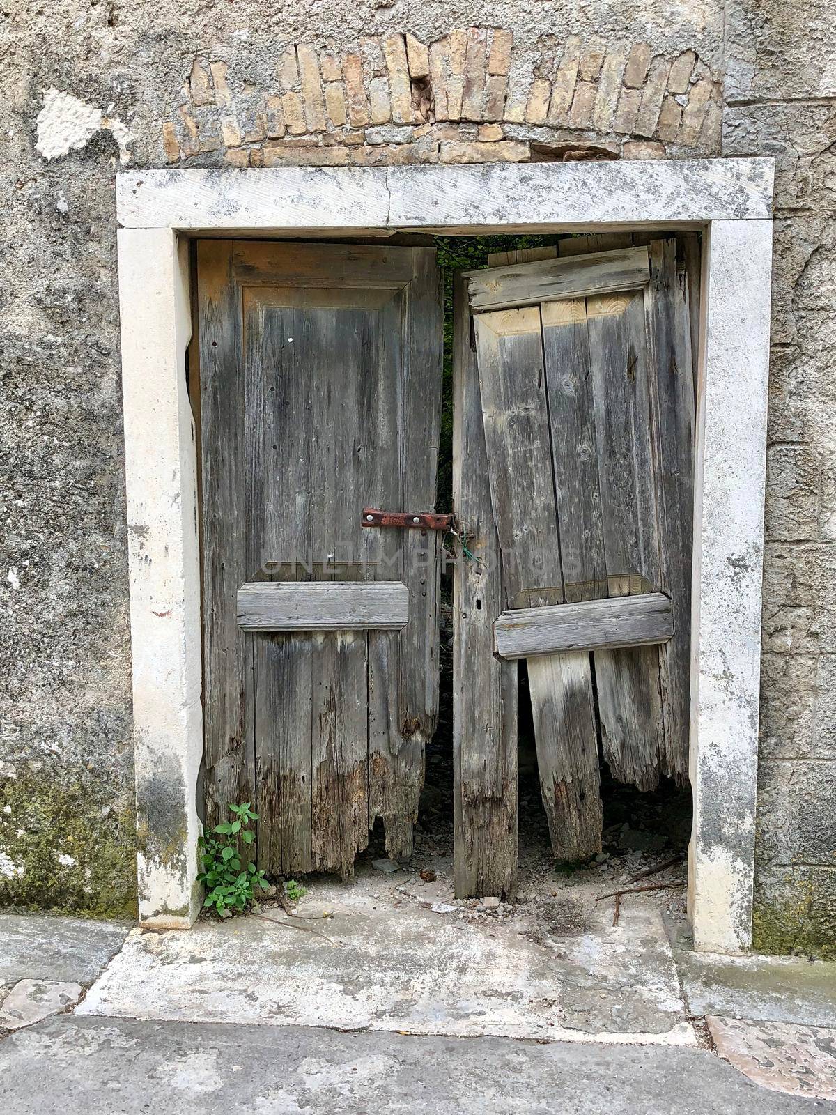 Old door in Zlarin  by traveltelly