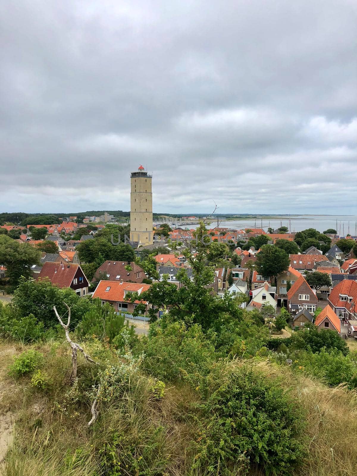 Town West-Terschelling with the lighthouse Brandaris by traveltelly