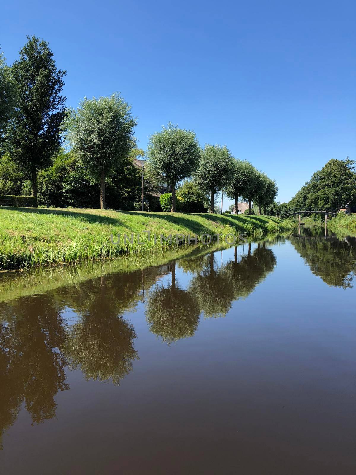 Canal in Earnewâld  by traveltelly