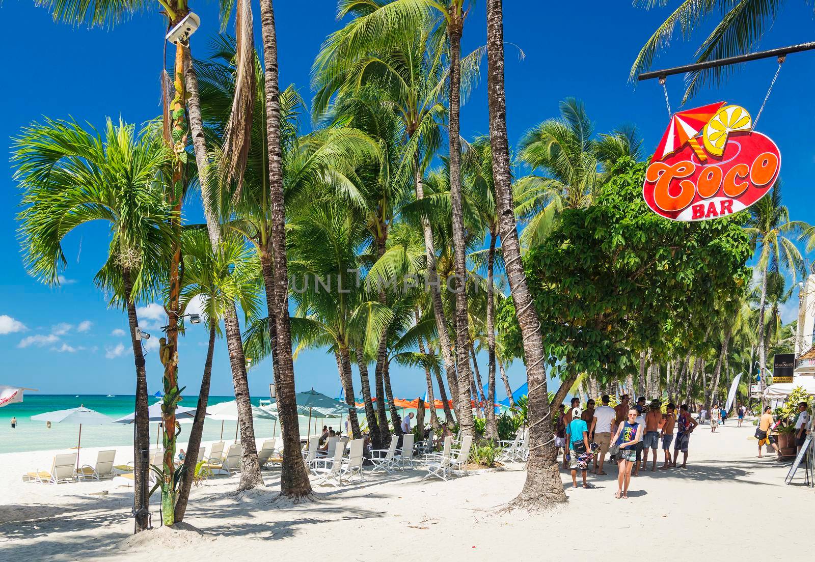 white beach bars on boracay tropical island in philippines by jackmalipan