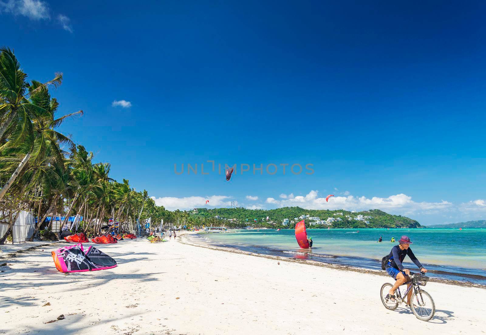 cycling and kitesurfing beach sports in boracay tropical island philippines