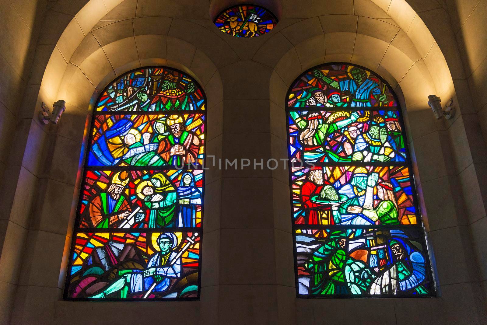 stained glass windows inside manila cathedral in philippines by jackmalipan