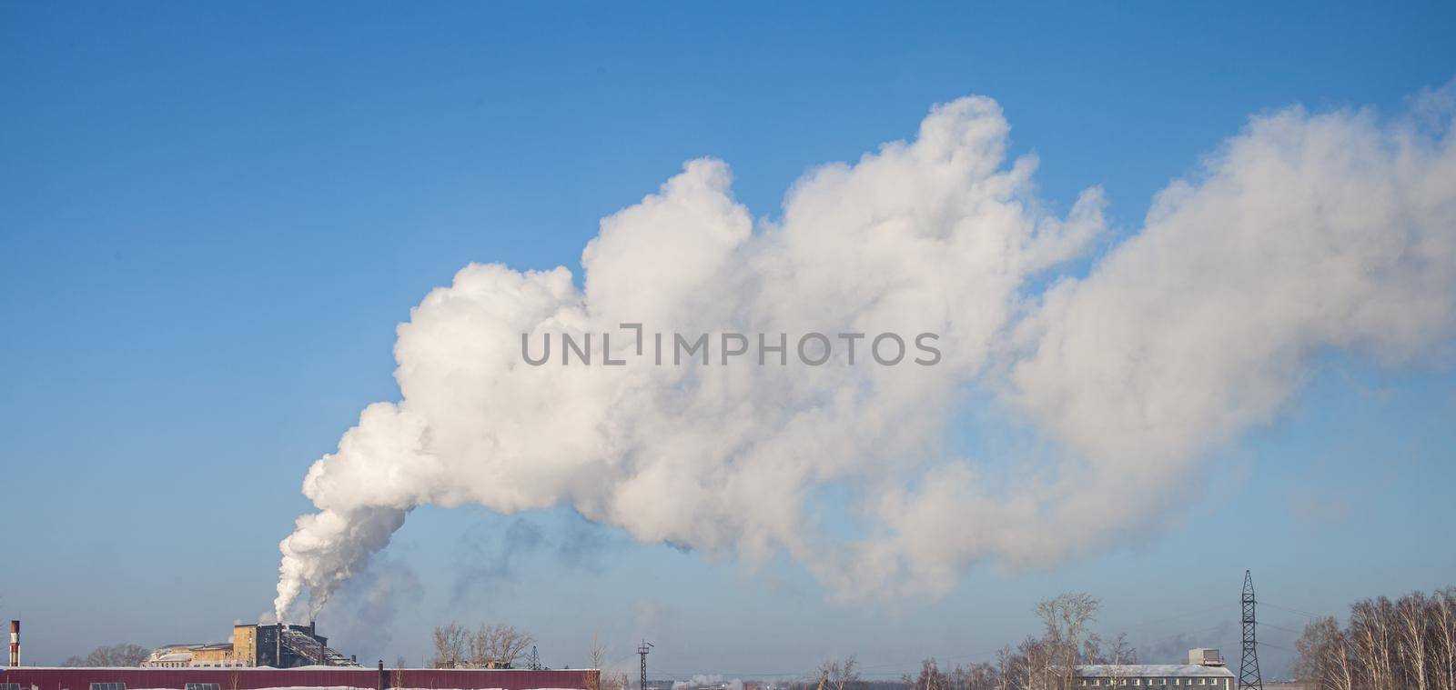 White thick smoke from the boiler room chimney. Industrial zone. by AnatoliiFoto