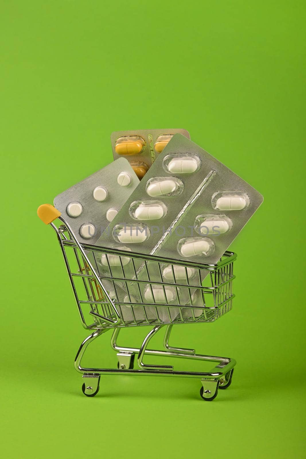 Several blister packs of pills in shopping cart by BreakingTheWalls