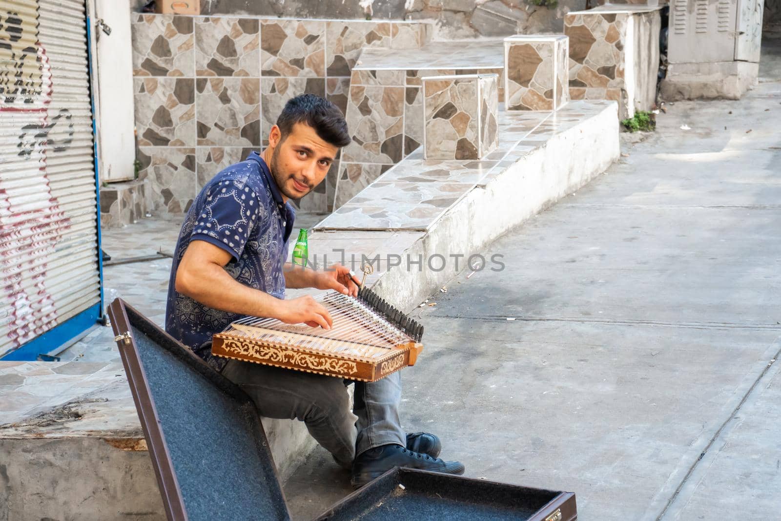 A young artist play music on qanun on the Istanbul city streets to get some money by Try_my_best