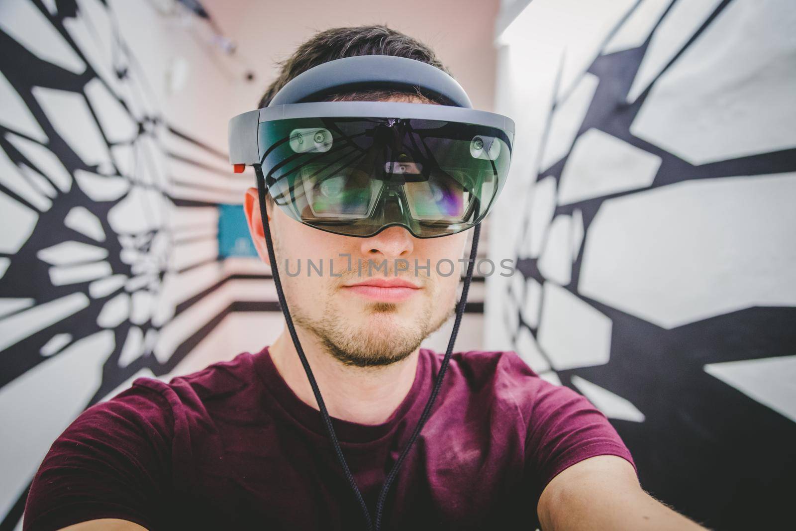 Young man is using virtual reality glasses or headset