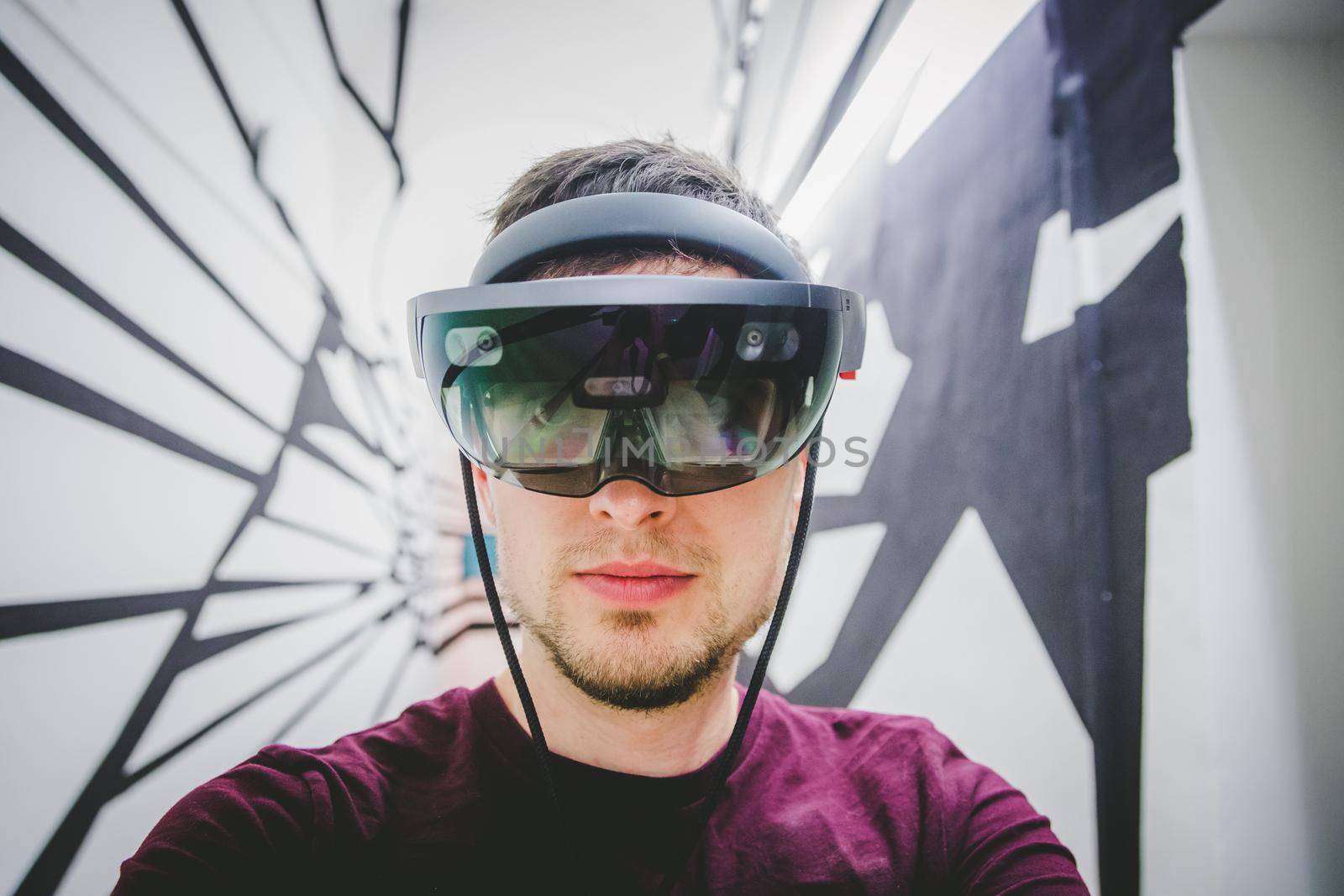 Young man is using virtual reality glasses or headset