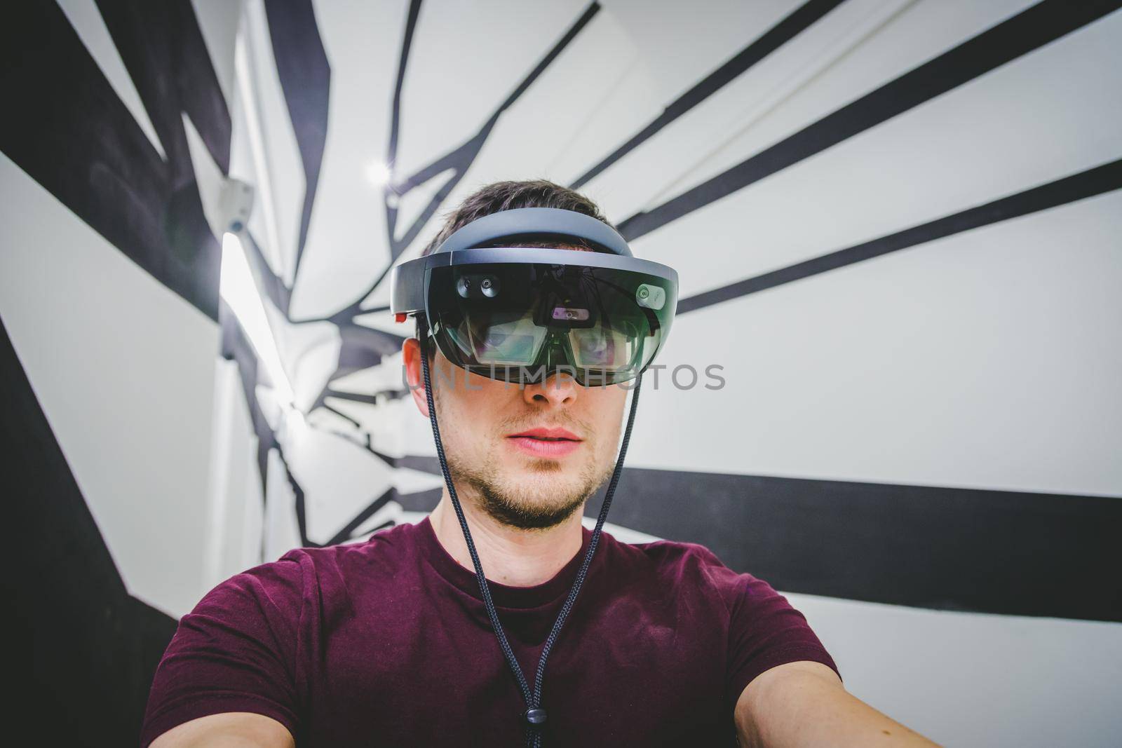 Young man is using virtual reality glasses or headset