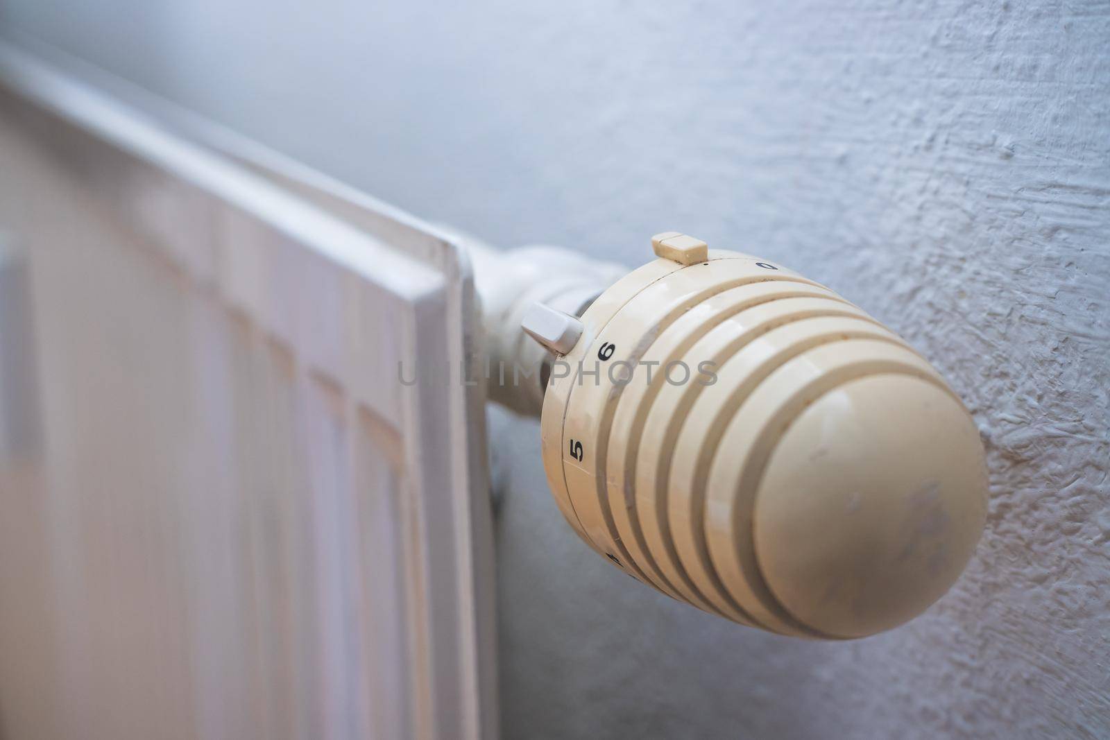Close up picture of a heat regulator. Good indoor climate. On.