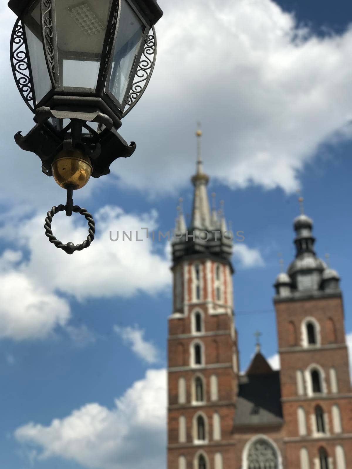 Lantern with in the background the St. Mary's Basilica in Krakow Poland