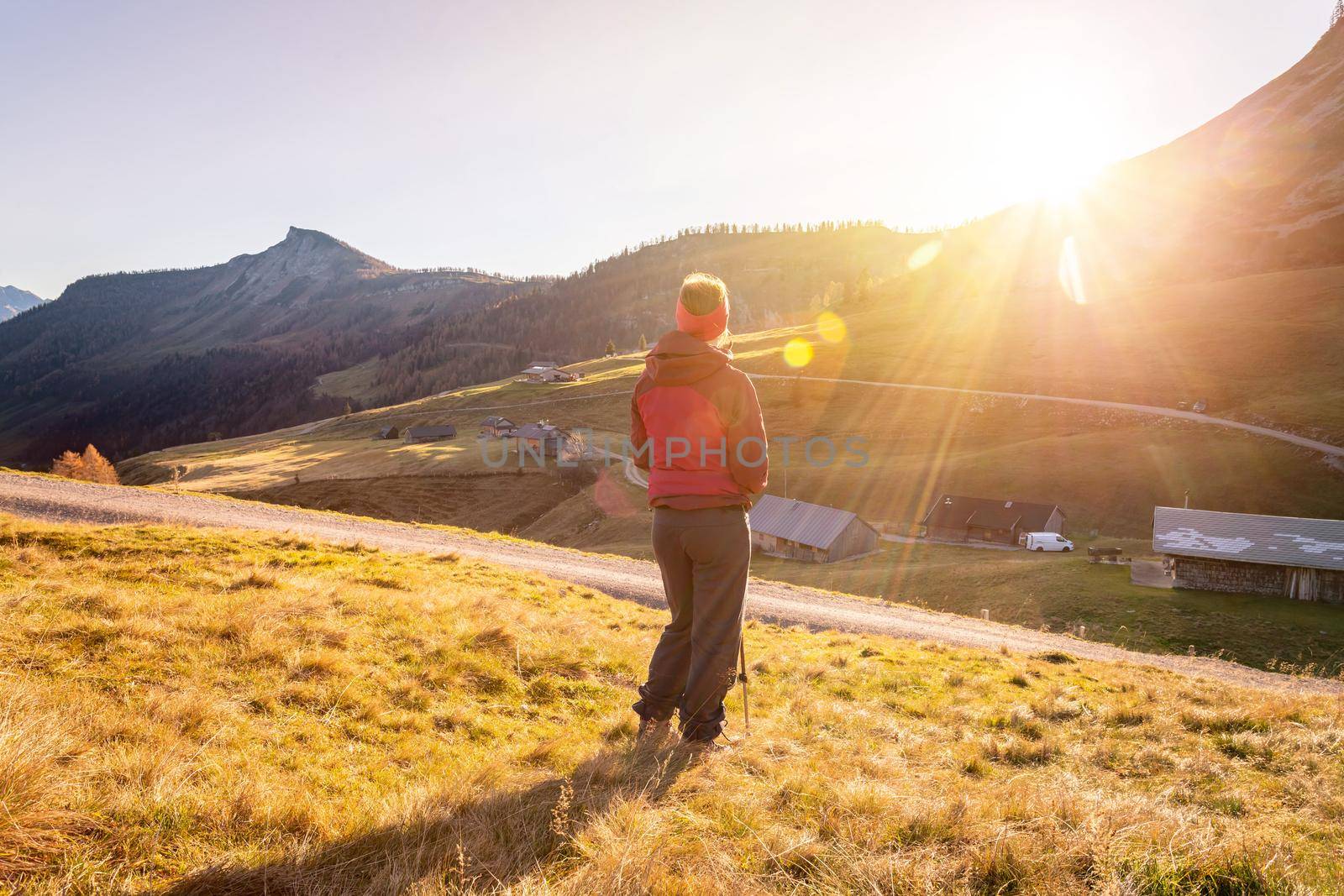 Woman in sportswear is enjoying the sunset in the mountains. Alpes, Austria