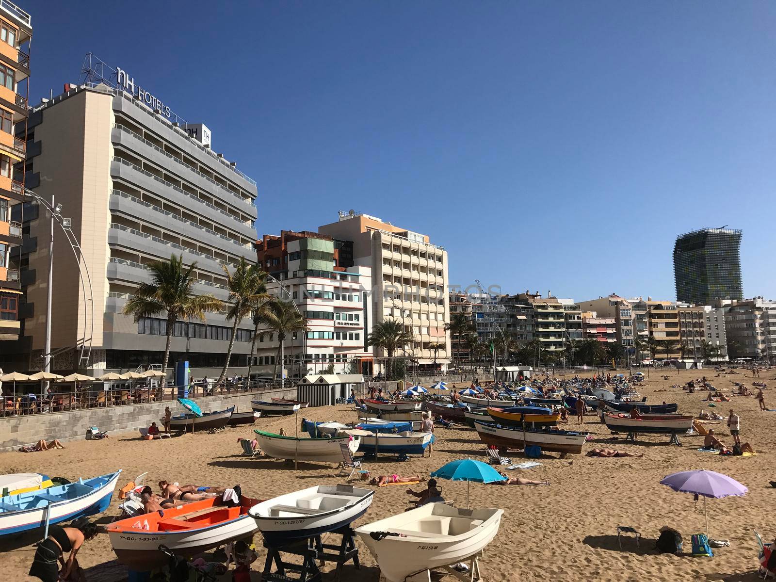 Boats and tourists at playa de Las Canteras in Las Palmas Gran Canaria