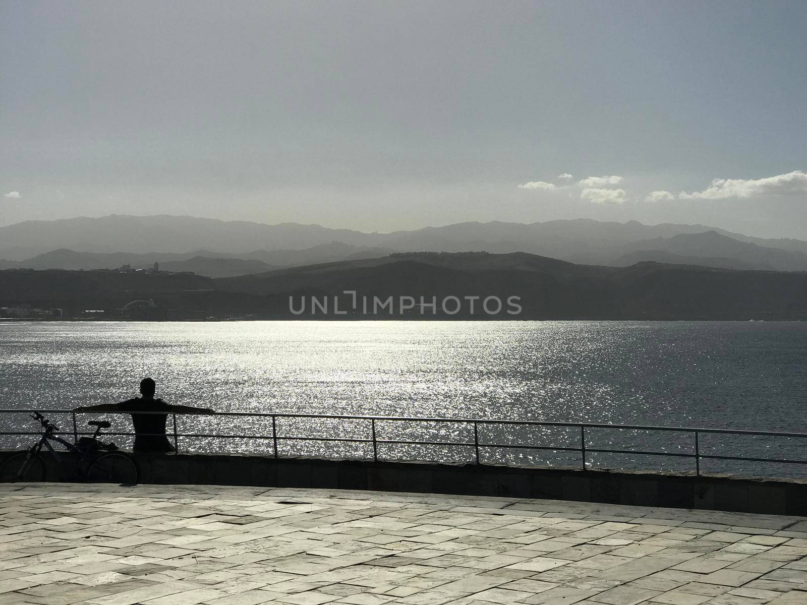 Shadow from a man and his bike by traveltelly