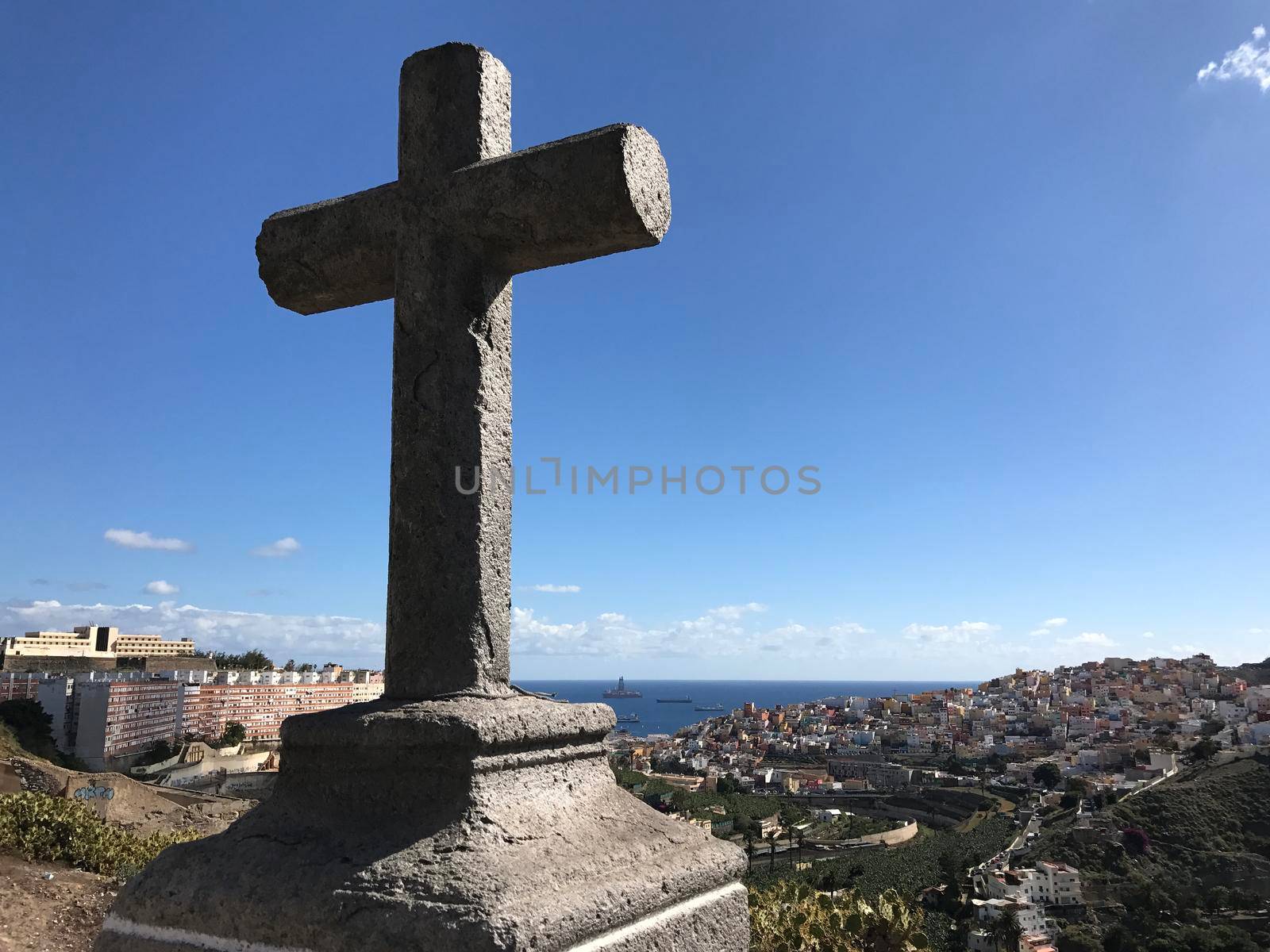 Cross looking out over Las Palmas by traveltelly