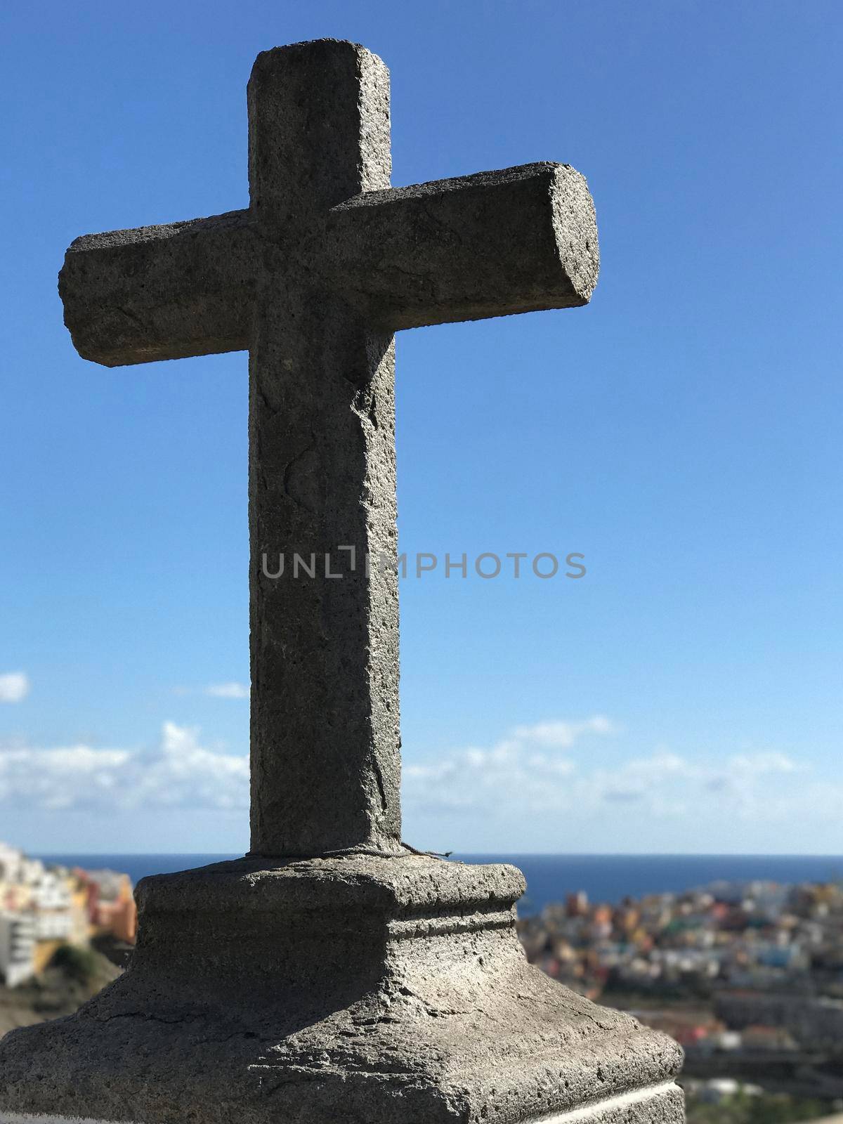Cross looking out over Las Palmas  by traveltelly